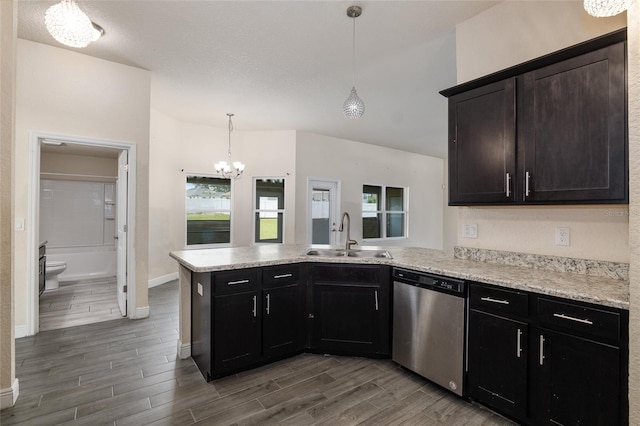 10910 SW 41st Ave, Ocala, FL 34476 - kitchen with dishwasher, a sink, a chandelier, a peninsula, and baseboards