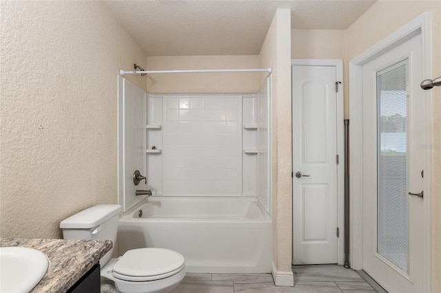 10910 SW 41st Ave, Ocala, FL 34476 - bathroom with a textured wall, vanity, bathing tub / shower combination, toilet, and a textured ceiling