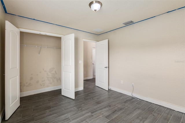 10910 SW 41st Ave, Ocala, FL 34476 - unfurnished bedroom with wood finished floors, baseboards, and a closet