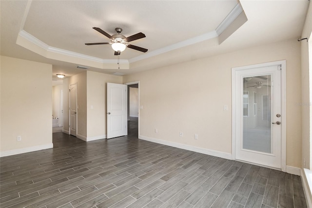 10910 SW 41st Ave, Ocala, FL 34476 - unfurnished room with a raised ceiling, a ceiling fan, crown molding, dark wood-style flooring, and baseboards