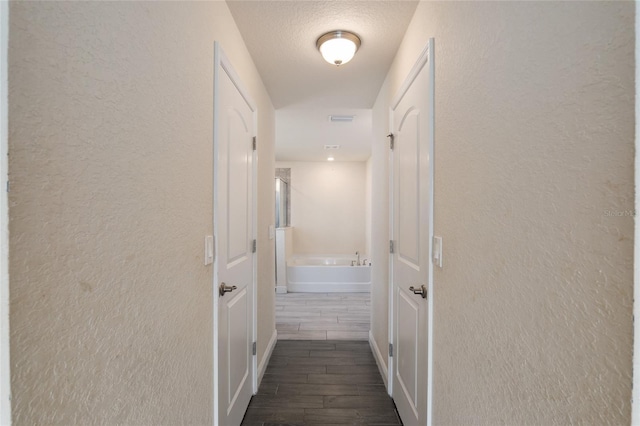 10910 SW 41st Ave, Ocala, FL 34476 - hall with a textured wall and wood tiled floors