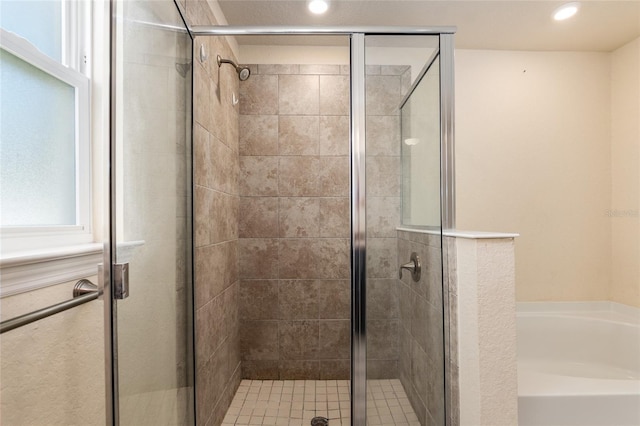 10910 SW 41st Ave, Ocala, FL 34476 - full bathroom with a stall shower, a garden tub, and recessed lighting