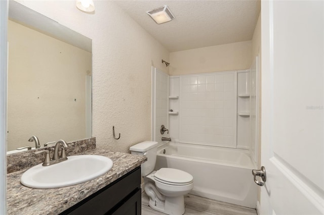 10910 SW 41st Ave, Ocala, FL 34476 - full bathroom with a textured wall, a textured ceiling, vanity, toilet, and  shower combination