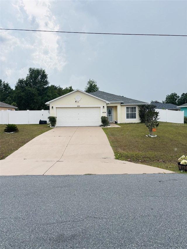 4704 SW 138th Loop, Ocala, FL 34473 - view of front facade with concrete driveway, an attached garage, and stucco siding