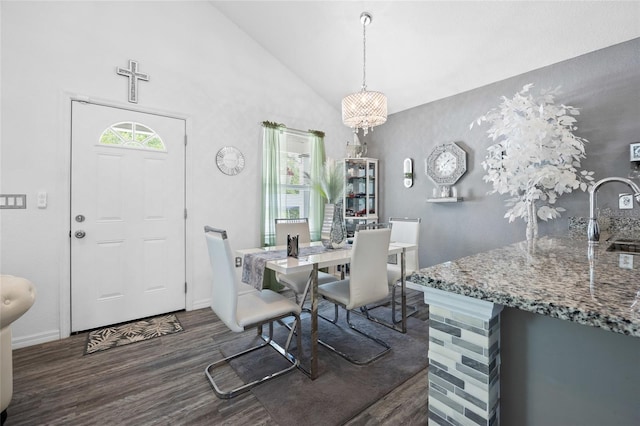15324 SW 40th Place Rd, Ocala, FL 34481 - dining space with wood finished floors, a chandelier, baseboards, and high vaulted ceiling