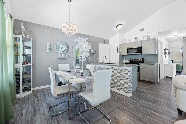 15324 SW 40th Place Rd, Ocala, FL 34481 - dining room with dark wood-style floors, high vaulted ceiling, and baseboards