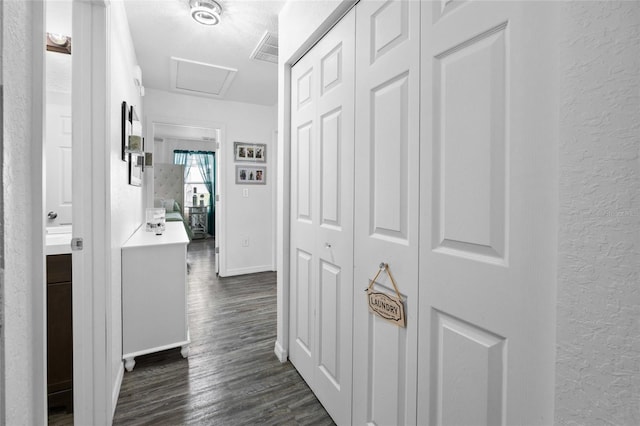 15324 SW 40th Place Rd, Ocala, FL 34481 - corridor featuring a textured wall, dark wood finished floors, attic access, baseboards, and a textured ceiling