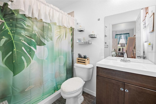 15324 SW 40th Place Rd, Ocala, FL 34481 - bathroom featuring toilet, vanity, wood finished floors, baseboards, and a shower with shower curtain