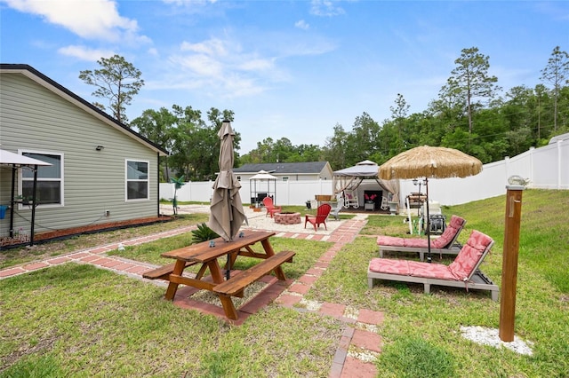 15324 SW 40th Place Rd, Ocala, FL 34481 - view of yard featuring an outdoor fire pit, a gazebo, and a patio area