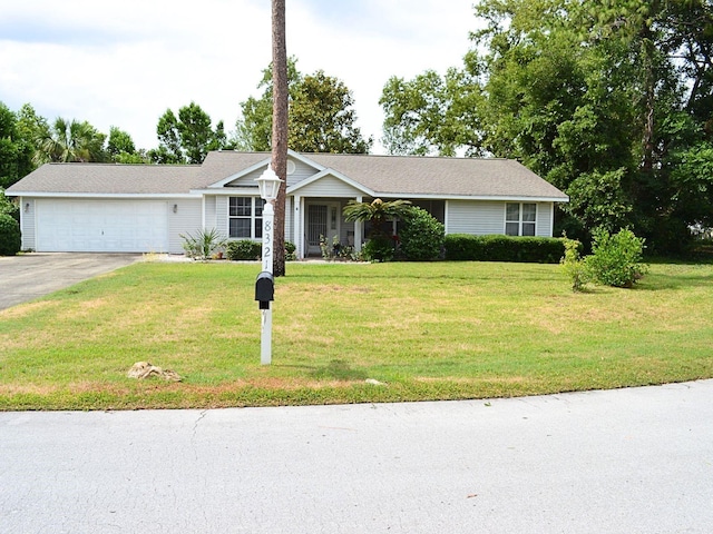 8321 SW 108th Place Rd, Ocala, FL 34481 - ranch-style house featuring a garage, concrete driveway, and a front lawn