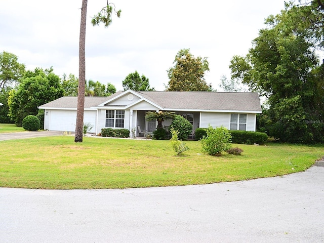 8321 SW 108th Place Rd, Ocala, FL 34481 - ranch-style home with driveway, an attached garage, and a front yard