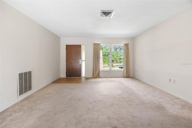 4467 SW Channel Heights Ct, Dunnellon, FL 34431 - empty room featuring light carpet, a textured ceiling, and baseboards