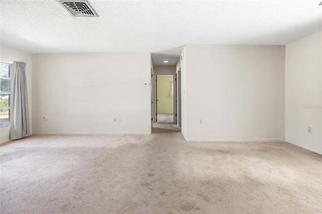 4467 SW Channel Heights Ct, Dunnellon, FL 34431 - carpeted empty room featuring a textured ceiling and baseboards