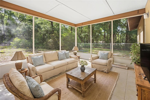 4467 SW Channel Heights Ct, Dunnellon, FL 34431 - sunroom / solarium featuring an outdoor living space and view of scattered trees