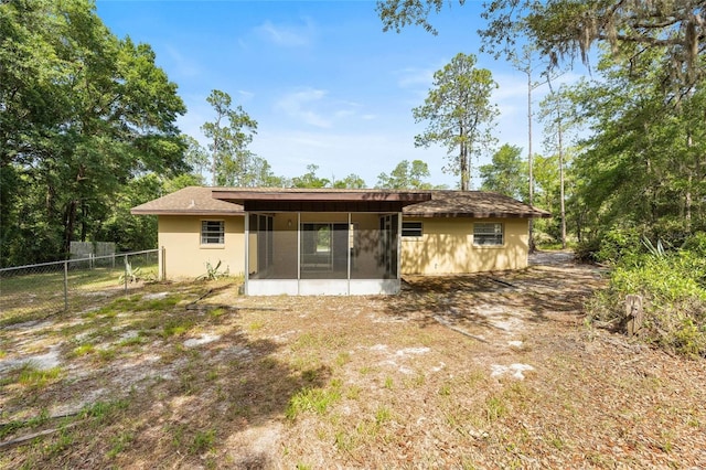 4467 SW Channel Heights Ct, Dunnellon, FL 34431 - back of house featuring a sunroom