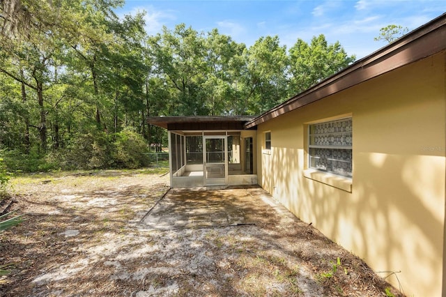 4467 SW Channel Heights Ct, Dunnellon, FL 34431 - view of patio with a sunroom