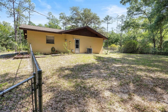 4467 SW Channel Heights Ct, Dunnellon, FL 34431 - back of property featuring stucco siding and central air condition unit