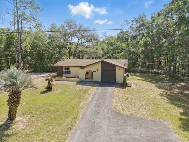 4467 SW Channel Heights Ct, Dunnellon, FL 34431 - view of front of house with driveway and an attached garage