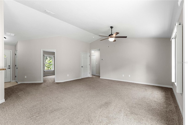 3445 SE 139th Ln, Summerfield, FL 34491 - unfurnished living room with light carpet, ceiling fan, baseboards, and lofted ceiling