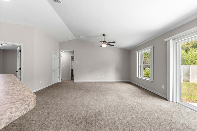 3445 SE 139th Ln, Summerfield, FL 34491 - unfurnished living room featuring vaulted ceiling, ceiling fan, carpet flooring, and baseboards