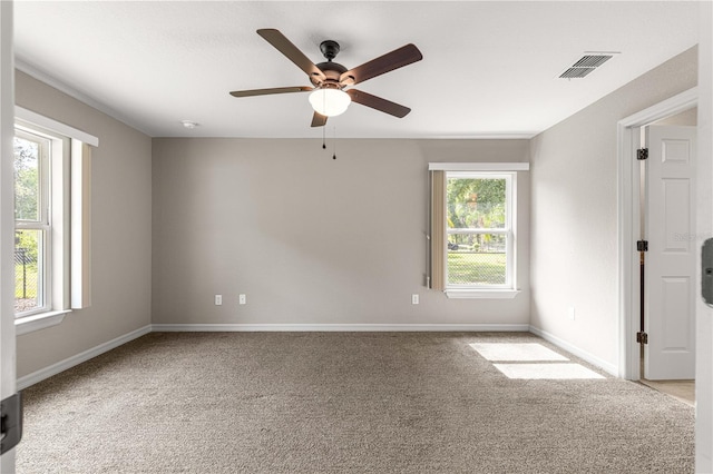 3445 SE 139th Ln, Summerfield, FL 34491 - empty room featuring plenty of natural light, a ceiling fan, carpet, and baseboards