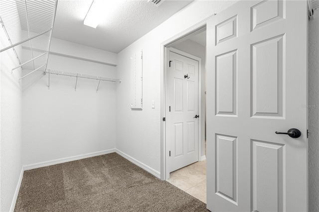 3445 SE 139th Ln, Summerfield, FL 34491 - walk in closet with light colored carpet