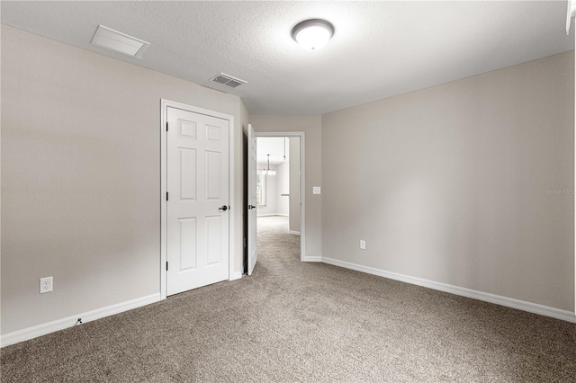 3445 SE 139th Ln, Summerfield, FL 34491 - empty room with carpet, baseboards, and a textured ceiling