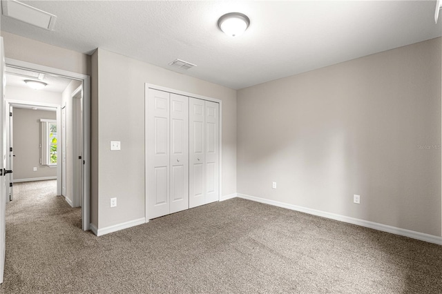 3445 SE 139th Ln, Summerfield, FL 34491 - unfurnished bedroom featuring carpet, a closet, and baseboards