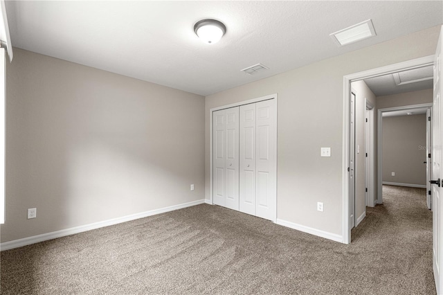 3445 SE 139th Ln, Summerfield, FL 34491 - unfurnished bedroom with carpet flooring, a closet, baseboards, and attic access