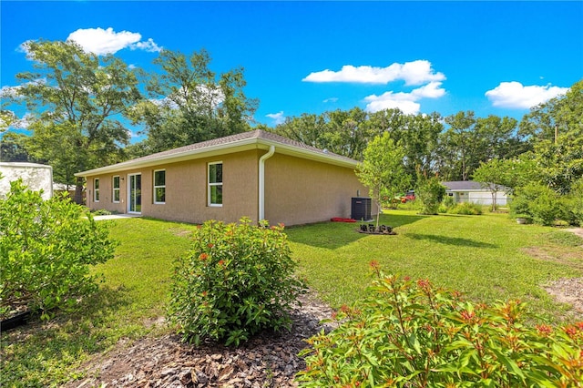 3445 SE 139th Ln, Summerfield, FL 34491 - view of grassy yard featuring central AC unit
