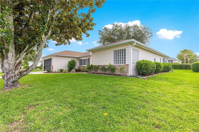 13715 SE 88th Ct, Summerfield, FL 34491 - view of front of house featuring a garage and a front lawn