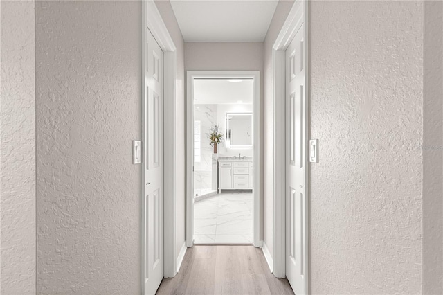 13715 SE 88th Ct, Summerfield, FL 34491 - corridor featuring a textured wall and wood finished floors