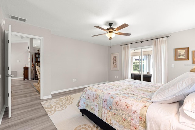 13715 SE 88th Ct, Summerfield, FL 34491 - bedroom with light wood-style flooring, access to outside, baseboards, and ceiling fan