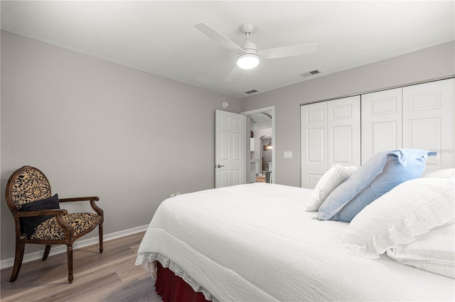 13715 SE 88th Ct, Summerfield, FL 34491 - bedroom featuring light wood finished floors, baseboards, a closet, and a ceiling fan