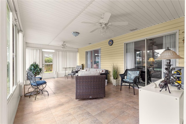 13715 SE 88th Ct, Summerfield, FL 34491 - sunroom / solarium featuring a ceiling fan and an outdoor living space