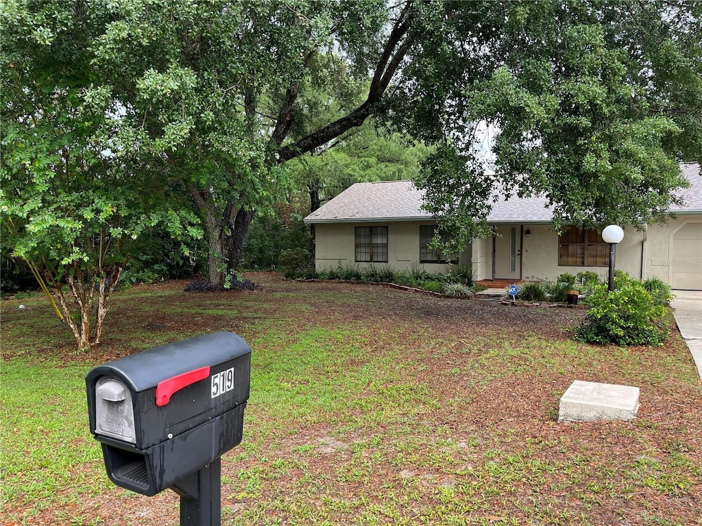 519 Spring Lake Rd, Ocala, FL 34472 - view of front of house featuring a front yard and stucco siding