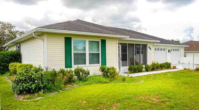 6190 SW 84th Pl, Ocala, FL 34476 - rear view of house with a garage and a yard