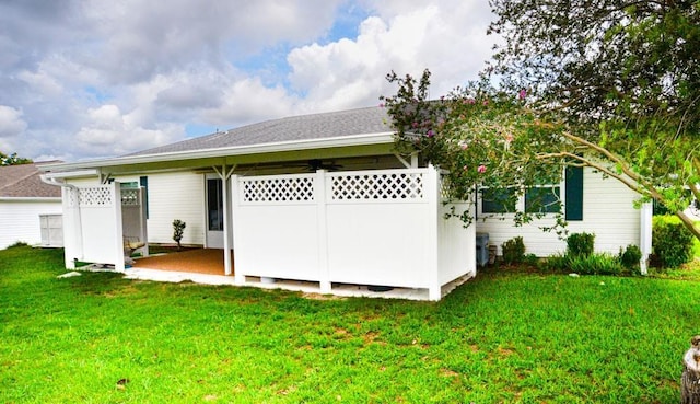 6190 SW 84th Pl, Ocala, FL 34476 - back of house featuring a lawn and a patio area