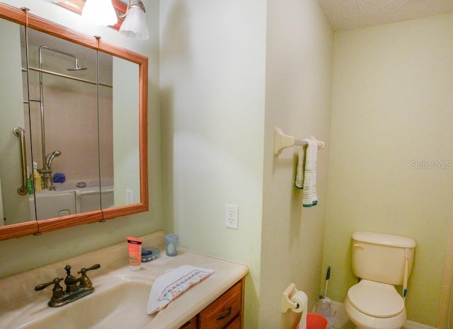 6190 SW 84th Pl, Ocala, FL 34476 - full bathroom with an enclosed shower, vanity, toilet, and a textured ceiling