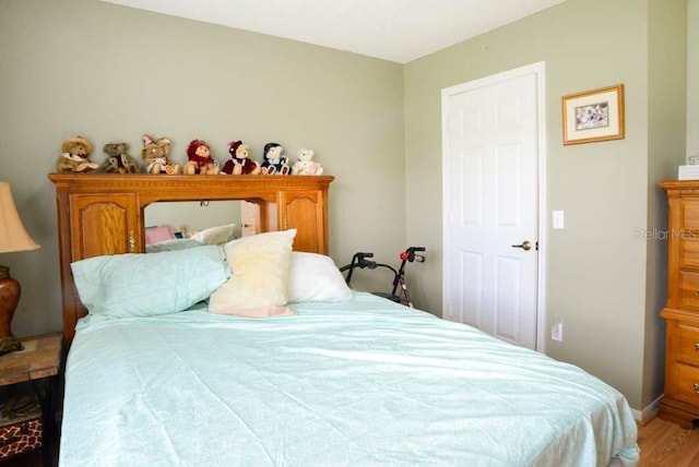 6190 SW 84th Pl, Ocala, FL 34476 - bedroom with wood finished floors and baseboards