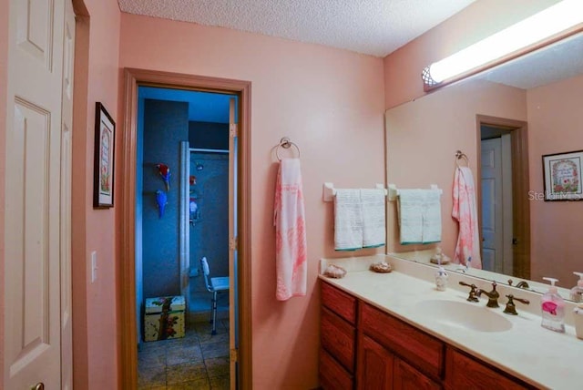 6190 SW 84th Pl, Ocala, FL 34476 - full bathroom featuring vanity, a textured ceiling, and a shower