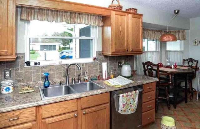 6190 SW 84th Pl, Ocala, FL 34476 - kitchen with dishwashing machine, a sink, decorative backsplash, and light countertops