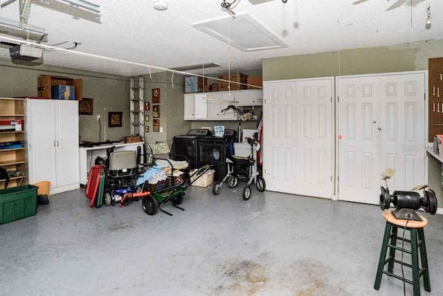 6190 SW 84th Pl, Ocala, FL 34476 - garage featuring washer / dryer and a garage door opener