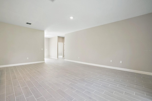 16195 SW 48th Cir, Ocala, FL 34473 - unfurnished room featuring baseboards, wood finished floors, and recessed lighting