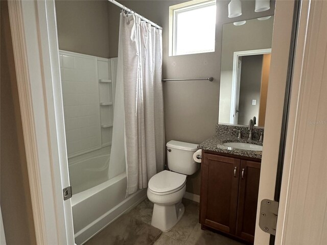 5255 NW 33rd Pl, Ocala, FL 34482 - bathroom featuring vanity, toilet, shower / bath combo with shower curtain, and tile patterned flooring