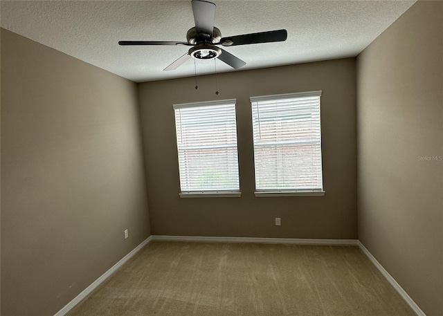 5255 NW 33rd Pl, Ocala, FL 34482 - unfurnished room featuring ceiling fan, a textured ceiling, light colored carpet, and baseboards