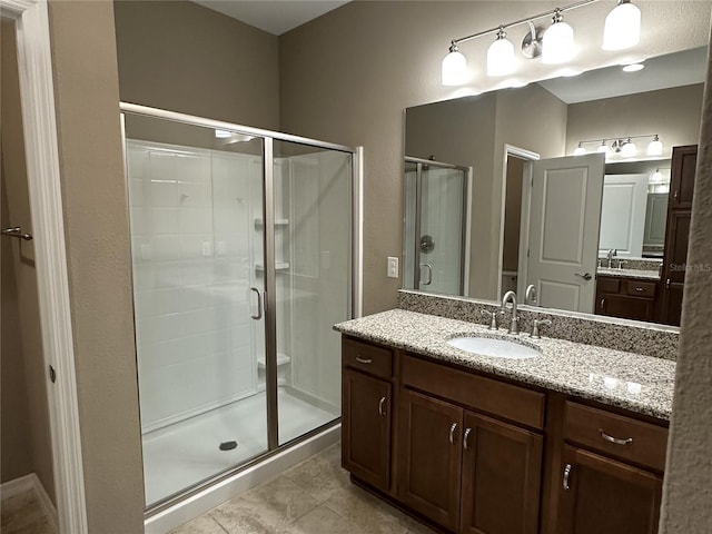 5255 NW 33rd Pl, Ocala, FL 34482 - bathroom with a shower stall, vanity, and tile patterned flooring