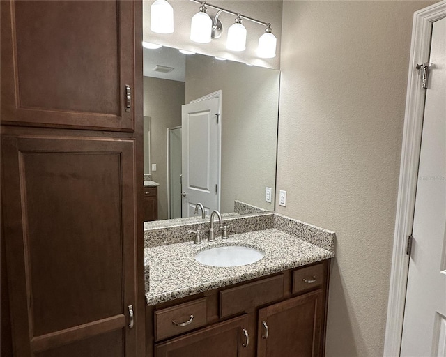 5255 NW 33rd Pl, Ocala, FL 34482 - bathroom featuring vanity and a textured wall
