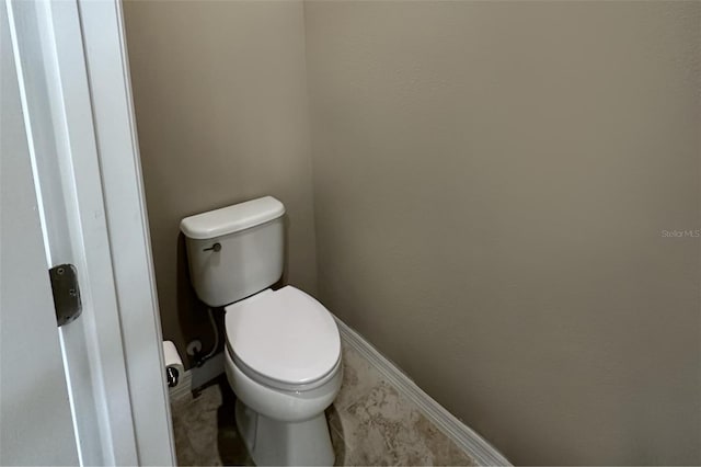 5255 NW 33rd Pl, Ocala, FL 34482 - bathroom featuring toilet and marble look tile flooring