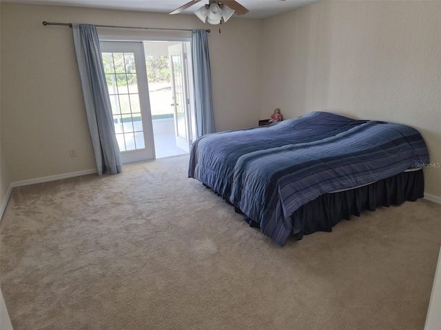 360 Marion Oaks Golf Way, Ocala, FL 34473 - bedroom with access to outside, carpet floors, baseboards, and a ceiling fan